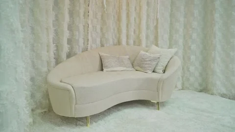 Small white sofa with decorative cushions Stock Footage 273141927