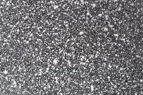 Small white spots on a dark background. Texture. Stock Photos