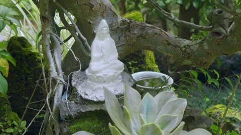 A small white statue of Bodhisattva Guan Yin or Avalokiteshvara Stock Footage 333319257