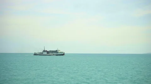Small white tourist ship sails fast on calm blue sea Stock Footage 132492355