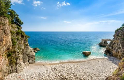 Small wild beach between the mountains Stock Photos