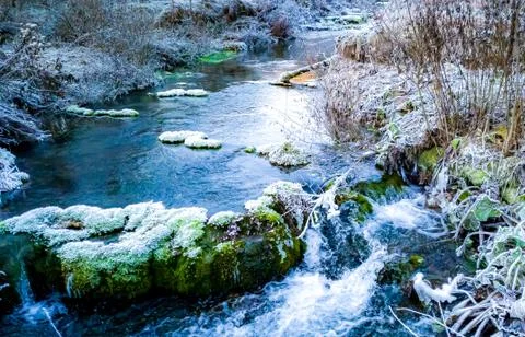 A small wild river in nature in early winter Stock Photos