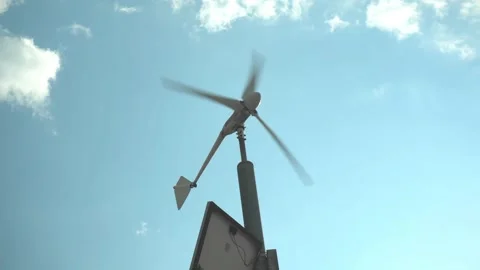 A small wind generator on a pole against the sky. Production of electricity in Video stock 209993001
