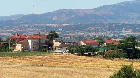 Small wind tornado dust devil Greece rural countryside village outdoor clear sky Stock Footage 313932864