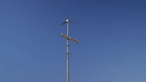 Small Wind Turbine and Solar Panel Stock Footage 338363513