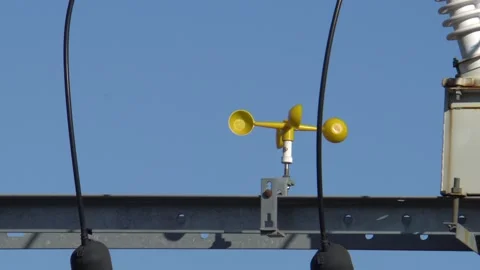 A small windmill that rotates on a power pole Stock Footage 231766894