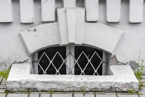 Small window of the basement with iron bars Stock Photos