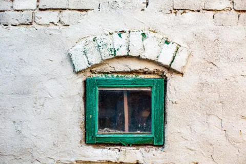 A small window in the brick wall of the chicken coop Stock Photos