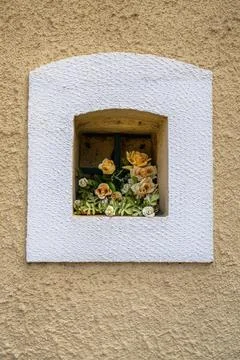 Small window filled with roses. Stock Photos