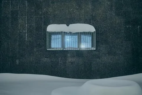 A small window with a grate on a granite wall, evening, winter Stock Photos