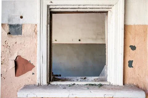 A small window inside an abandoned building Stock Photos