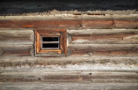 Small window, log wall Stock Photos