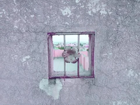 Small window in the mid of a textured wall Stock Photos