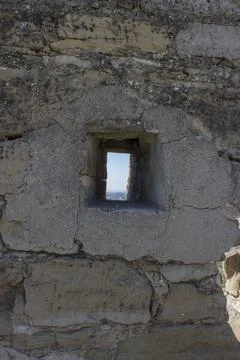 A small window in an old brick wall Stock Photos