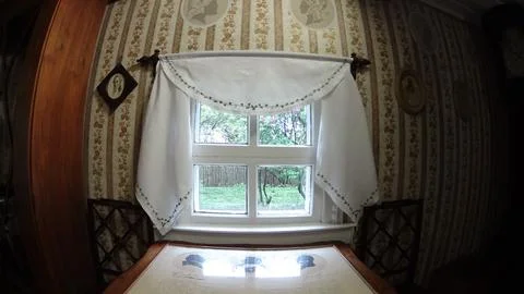 Small window in an old house. Stock Photos