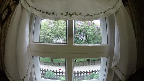 Small window in an old house. Stock Photos