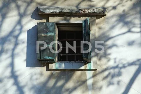 Small window in the old wall Stock Photos