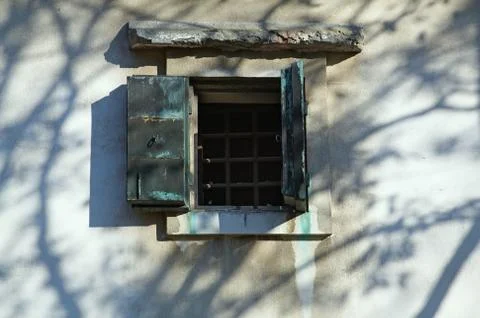 Small window in the old wall Stock Photos