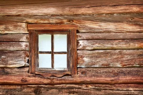 Small window in the old wooden wall Stock Photos