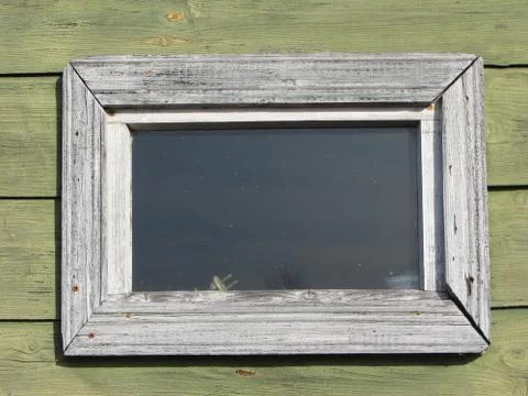 Small window on the wooden structure Stock Photos