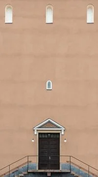Small windows on large building facade Stock Photos