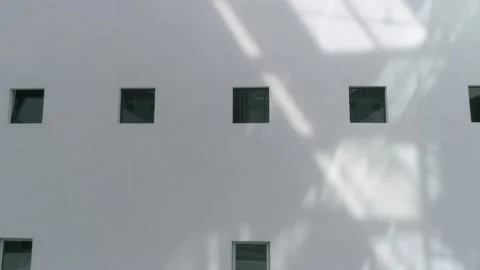 Small windows on a white internal facade of a building Vídeos de archivo 152762975