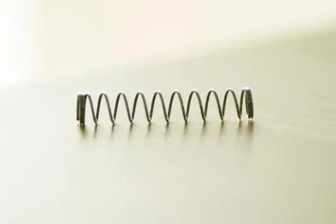 Small wire spring of a ballpoint pen Stock Photos