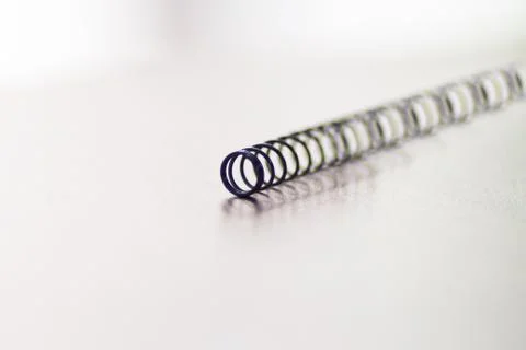 Small wire spring of a ballpoint pen Stock Photos