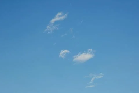Small Wispy Clouds in a Clear Blue Sky Fotos de archivo