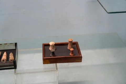 A small wooden box with three objects in it. in Chennai Stock Photos