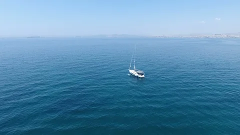 A small yacht is getting ready to cross the big sea Stockbeeldmateriaal 127713725