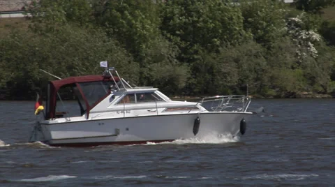 Small yacht on a river Stock Footage 32198384