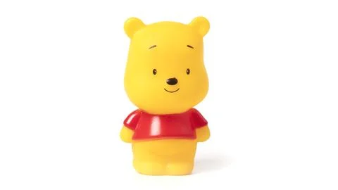 Small yellow bear toy isolated on white background. Stock Photos