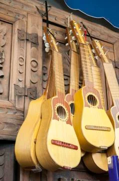 Small yellow colored guitars Stock Photos