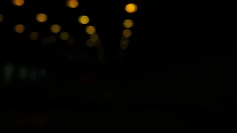 Small yellow light on a black background. Video stock 84020184