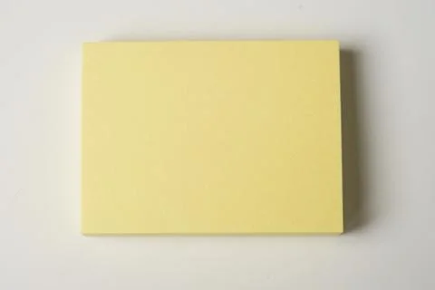 Small yellow paper to write Note Stock Photos
