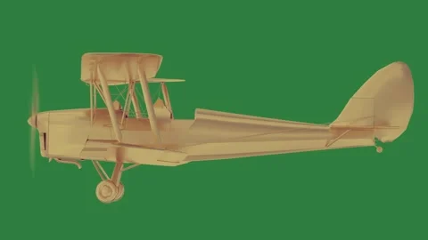 A small yellow plane on green screen and the is golden model of an airplane Stock Footage 335977655