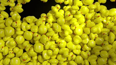 Small yellow rubber ducks falling and accumulating in massive pile against stark Stock Footage 309991134