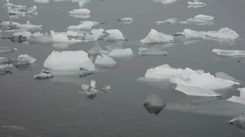 Smaller peaces of white ice floating in the Glacier lagoon, Iceland Stock Footage 33778533