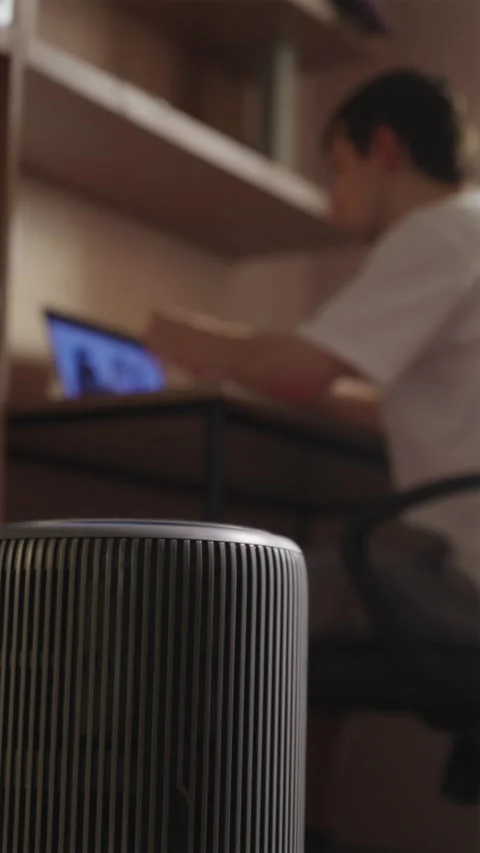 Smart air purifier working with freelancer on background vertical Video stock 343872523