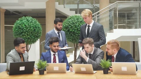 Smart and young men conduct negotiations in business office. Stock Footage 120935136