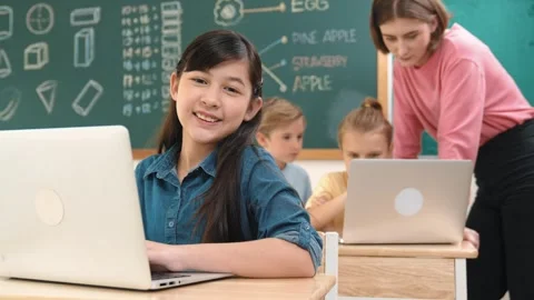 Smart asian girl looking at camera while coding engineering prompt. Pedagogy. Stock Footage 276229710