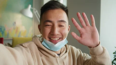 Smart Asian guy using video call communicate with business colleague friend from Stock Footage 135838926