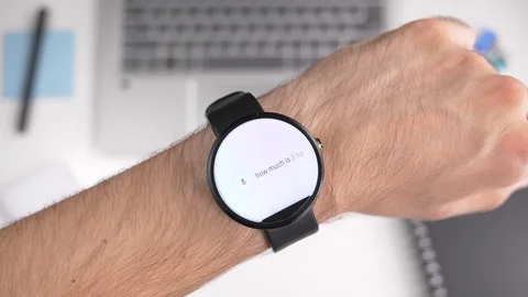 Smart Assistant Answers Question on Smartwatch Video stock 105463528