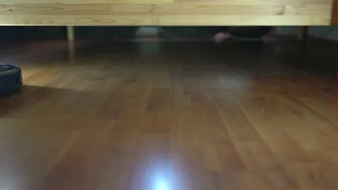 Smart Automatic Cleaning Robot Moving Over The Wooden Floor Stock Footage 180833384