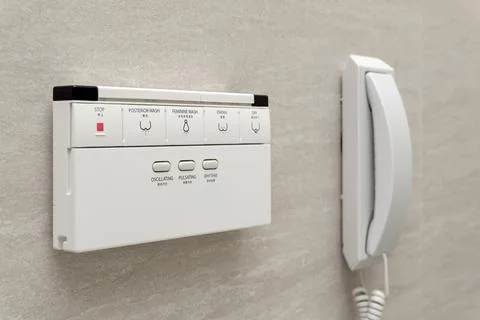 Smart bidet remote control, electronic toilet operation panel Stock Photos