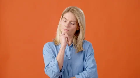 Smart blonde thinking and finding brilliant idea for problem Stock Footage 250792825