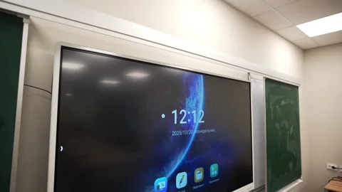 Smart board demonstrating standby mode during school break Stockbeeldmateriaal 332718336