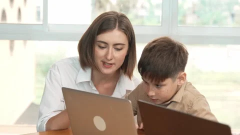 Smart boy playing laptop with multicultural friend learning prompt. Erudition. Stock Footage 270322455