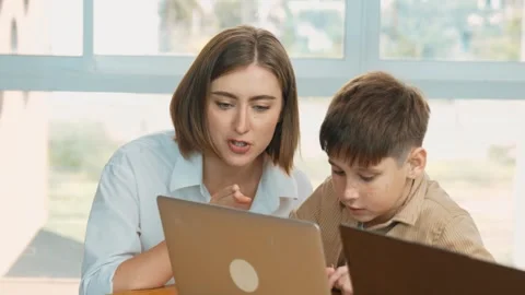 Smart boy playing laptop with multicultural friend learning prompt. Erudition. Stock Footage 278932230